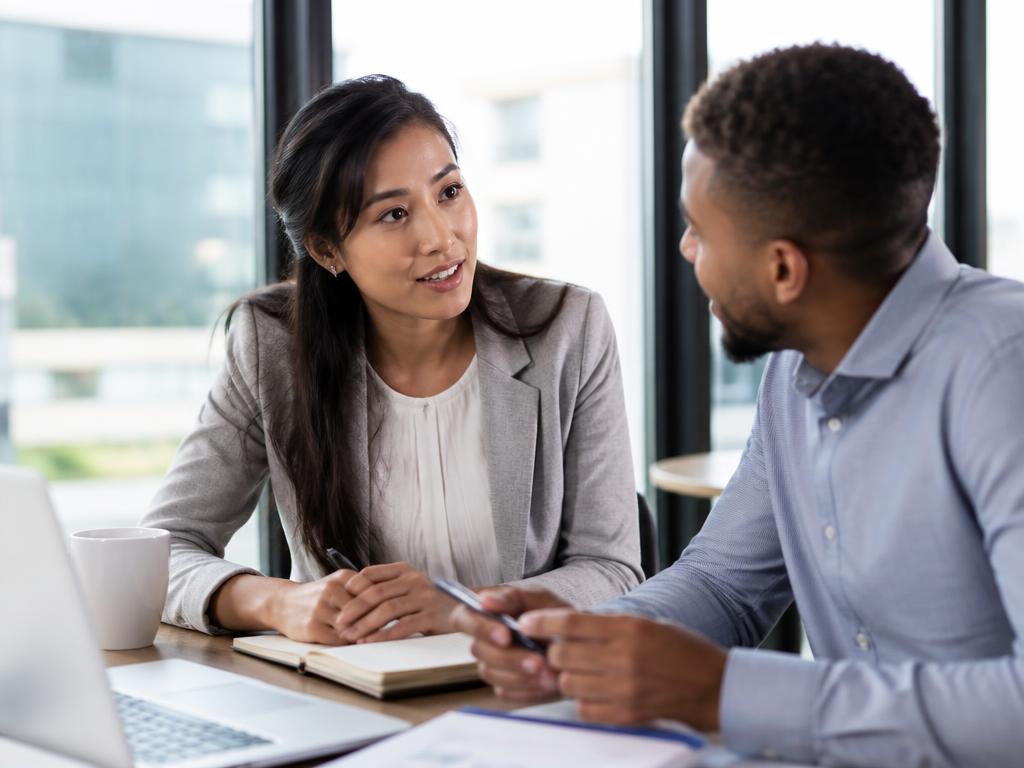 Two young people talking through career options together