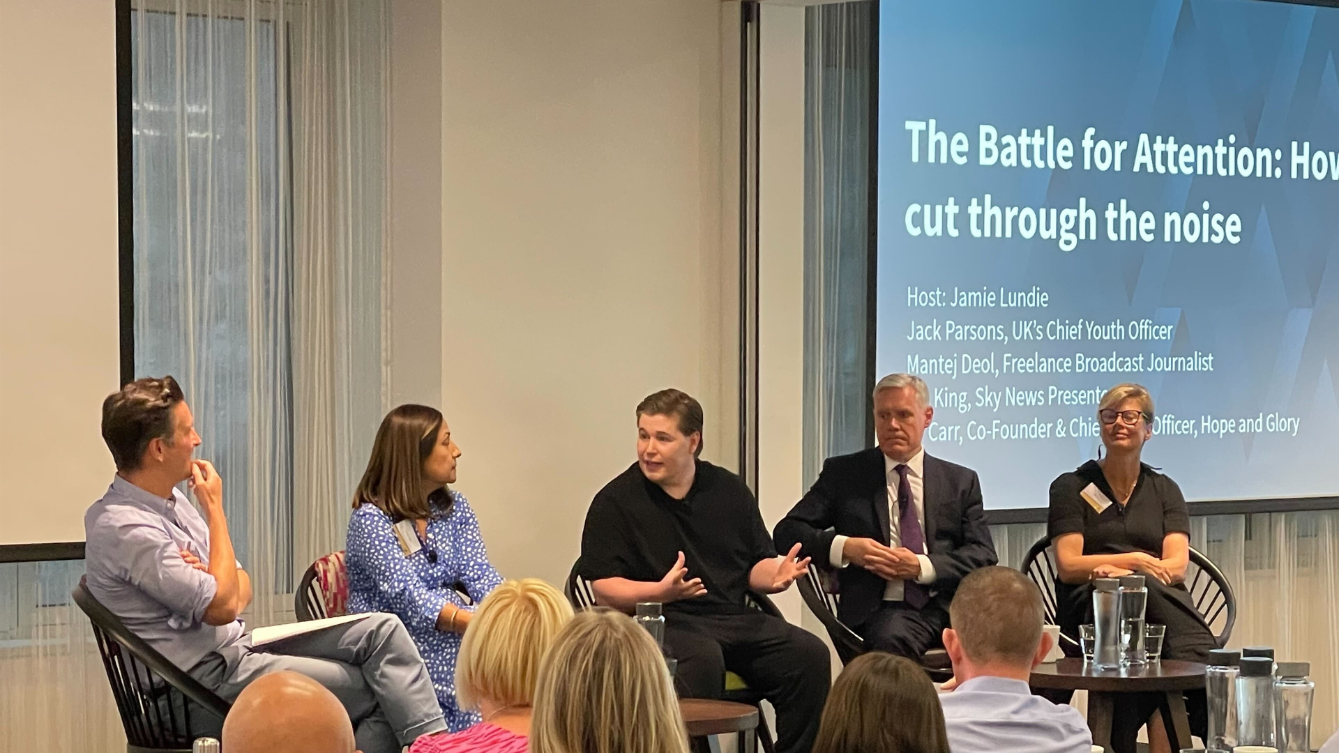 Jackson Parsons speaking on a panel